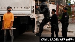 La policía antidisturbios recorre las calles luego de una manifestación contra el gobierno de Miguel Díaz-Canel en el municipio de Arroyo Naranjo, La Habana el 12 de julio de 2021.